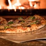 por que as pizzas feitas no forno a lenha sao mais saborosas